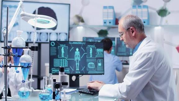 Researcher working at a digital laboratory workstation.