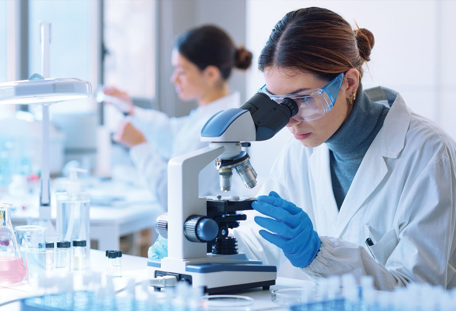 Researcher using a microscope in a laboratory