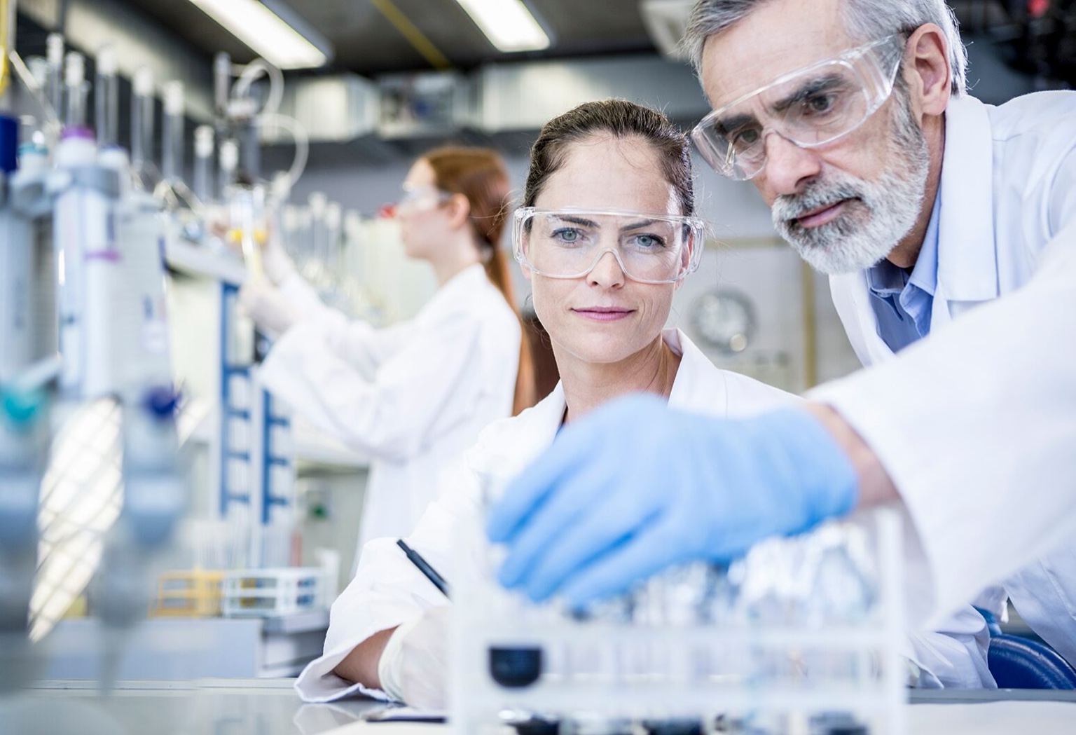 Clinical researchers collaborating in a laboratory.